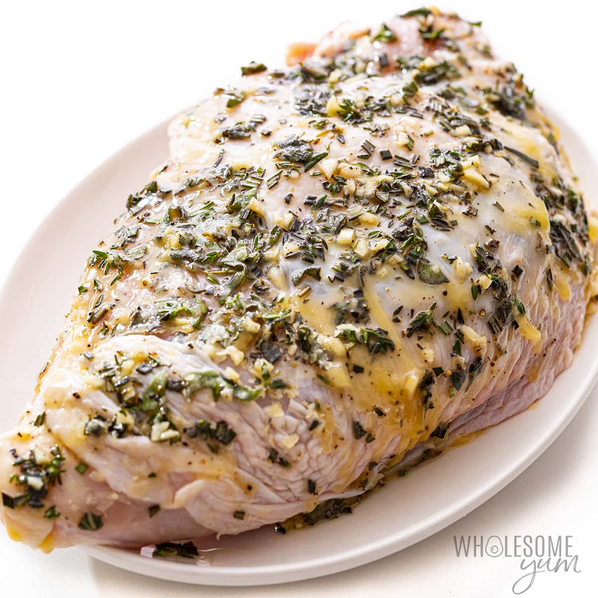 Herb butter rubbed on turkey breast.