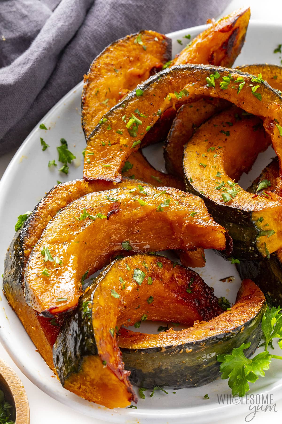 Place the kabocha pumpkin wedges on a plate.