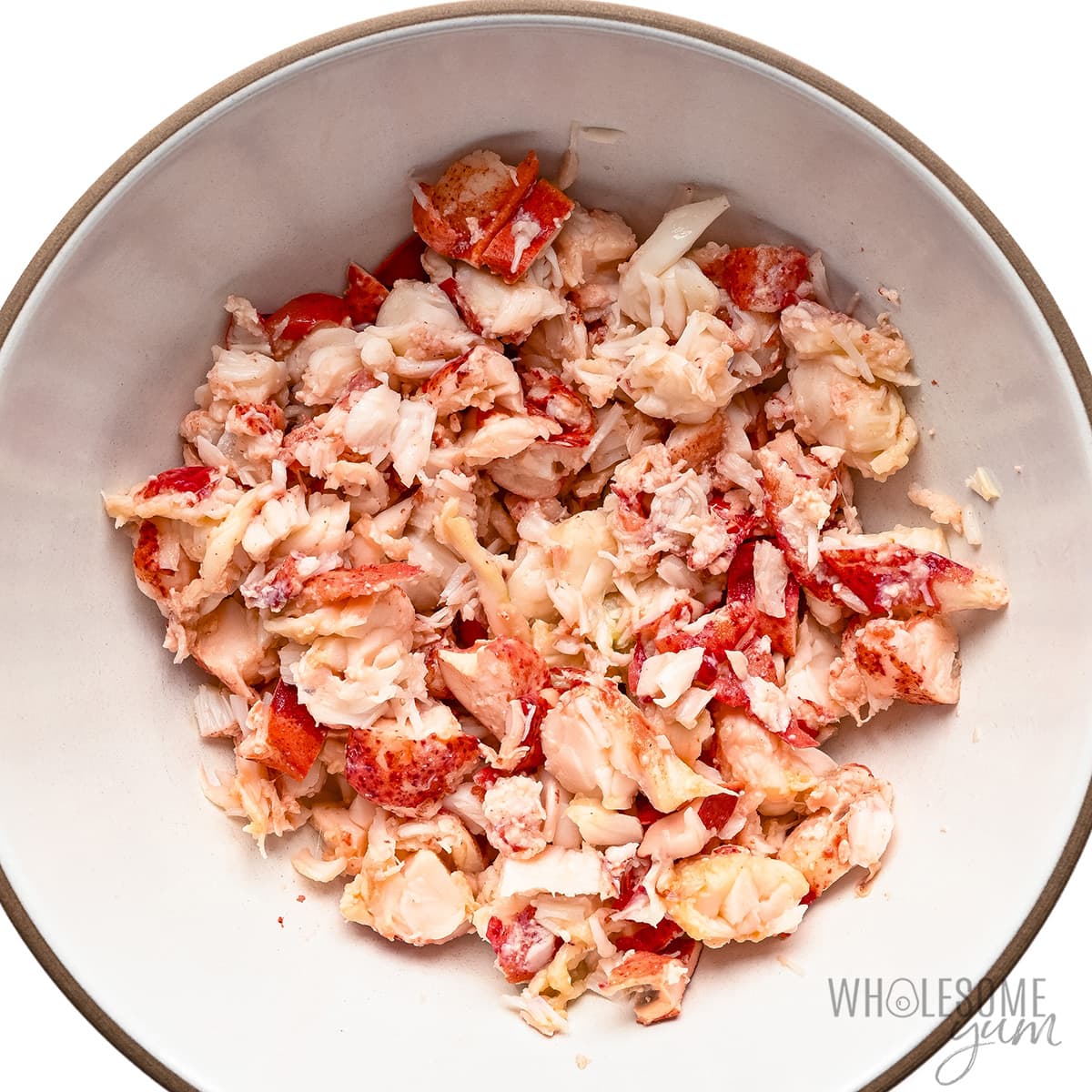 Small chunks of lobster meat in a bowl.
