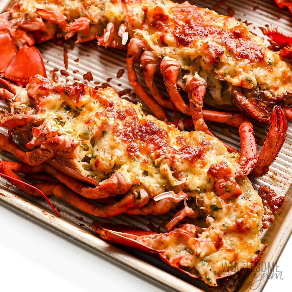 Broiled lobster Thermidor on a sheet pan.