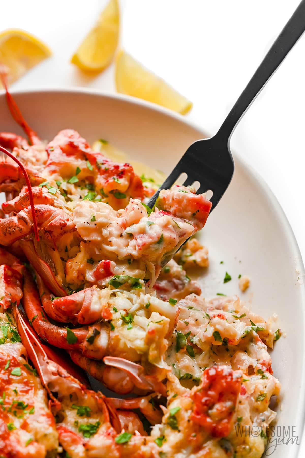 Use a fork to serve the lobster on a plate.