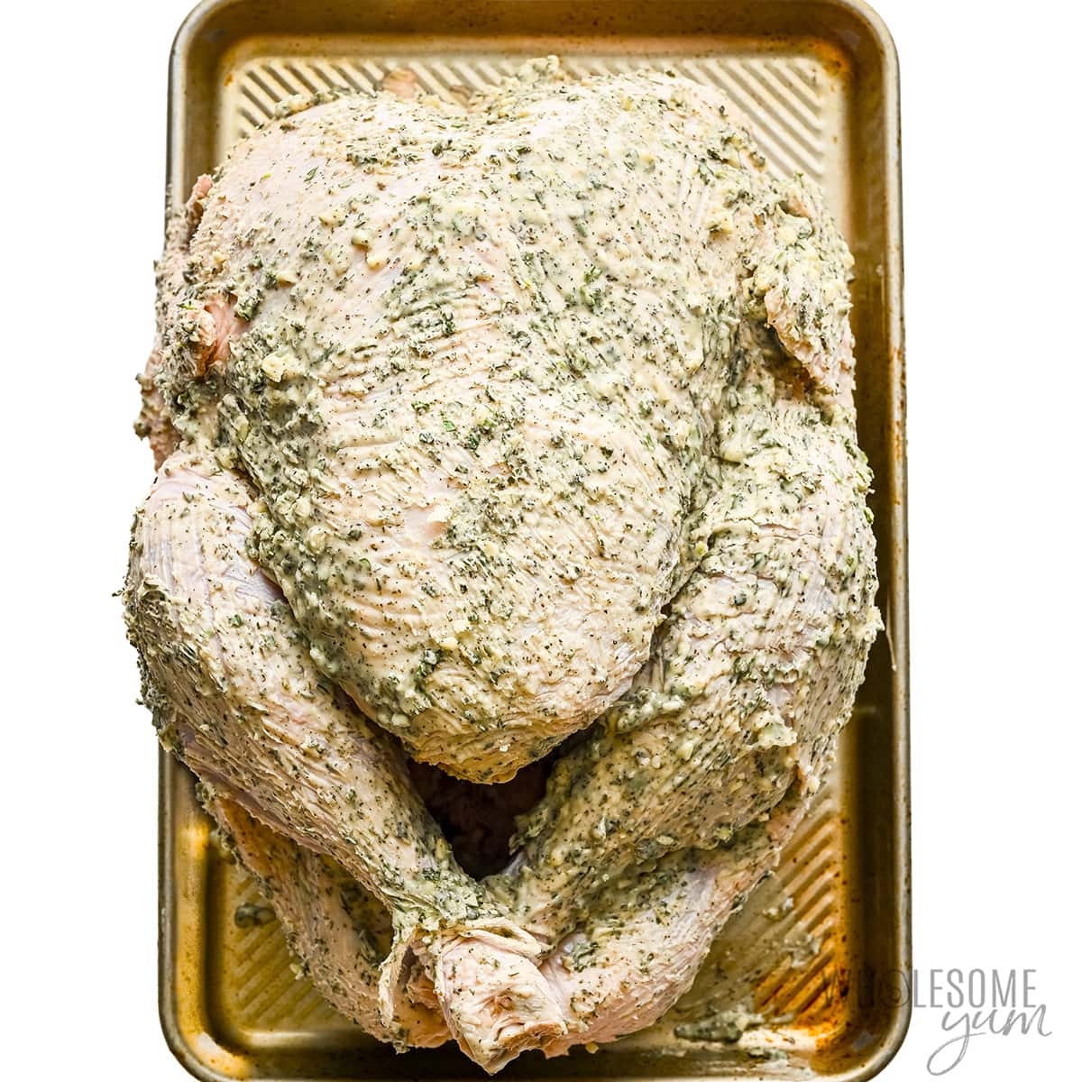 Herb butter rubbed on turkey.