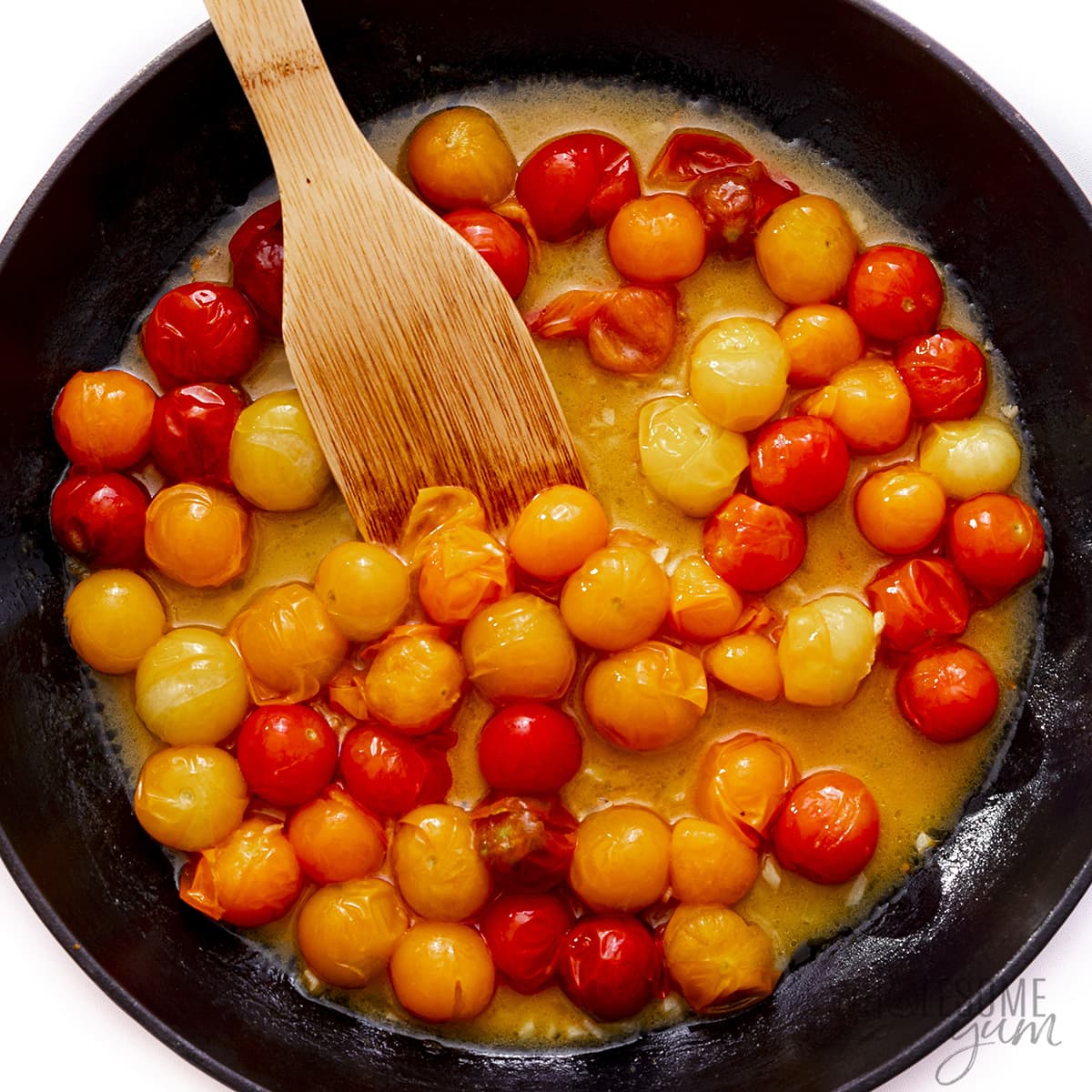 Tomato and wine sauce in a skillet.