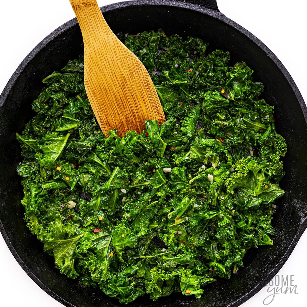 Finished sauteed kale in a skillet.