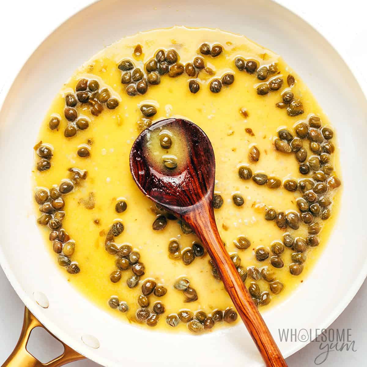 Lemon butter caper sauce in the skillet.