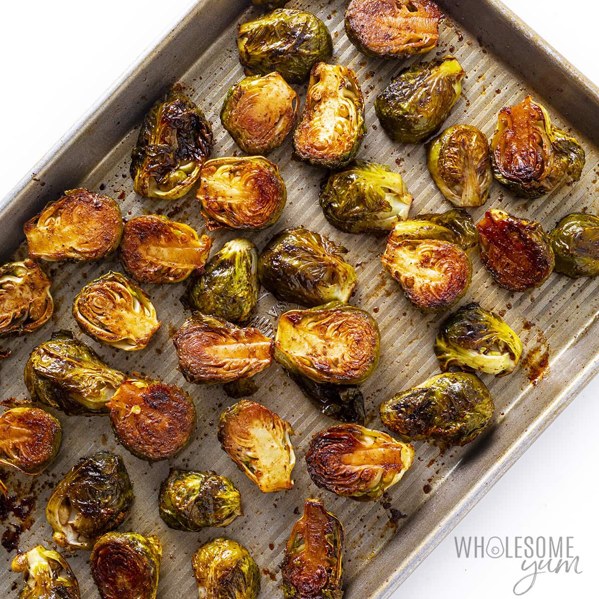 Roasted balsamic brussels sprouts on a baking sheet.