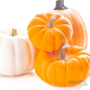 Four pumpkins on white background.