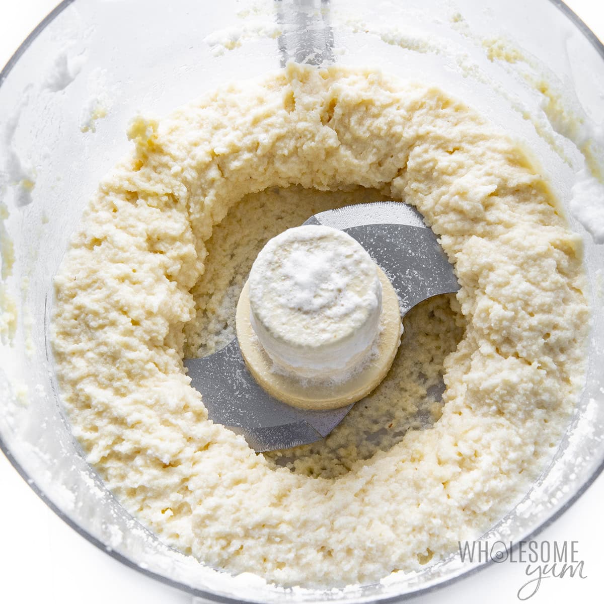 Fluffy dough in the food processor after adding egg whites.