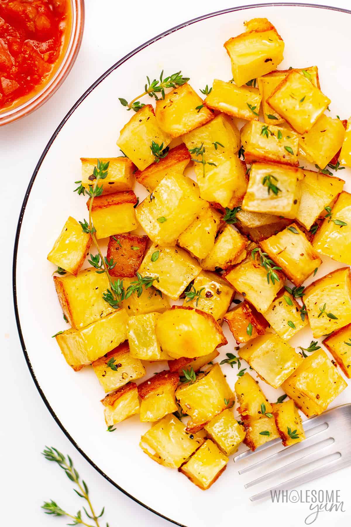 Cooked rutabaga in the fridge with fresh thyme.