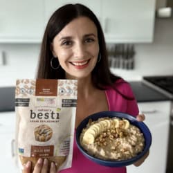 Maya holding a creamy bowl of banana oatmeal and a bag of Besti Brown.
