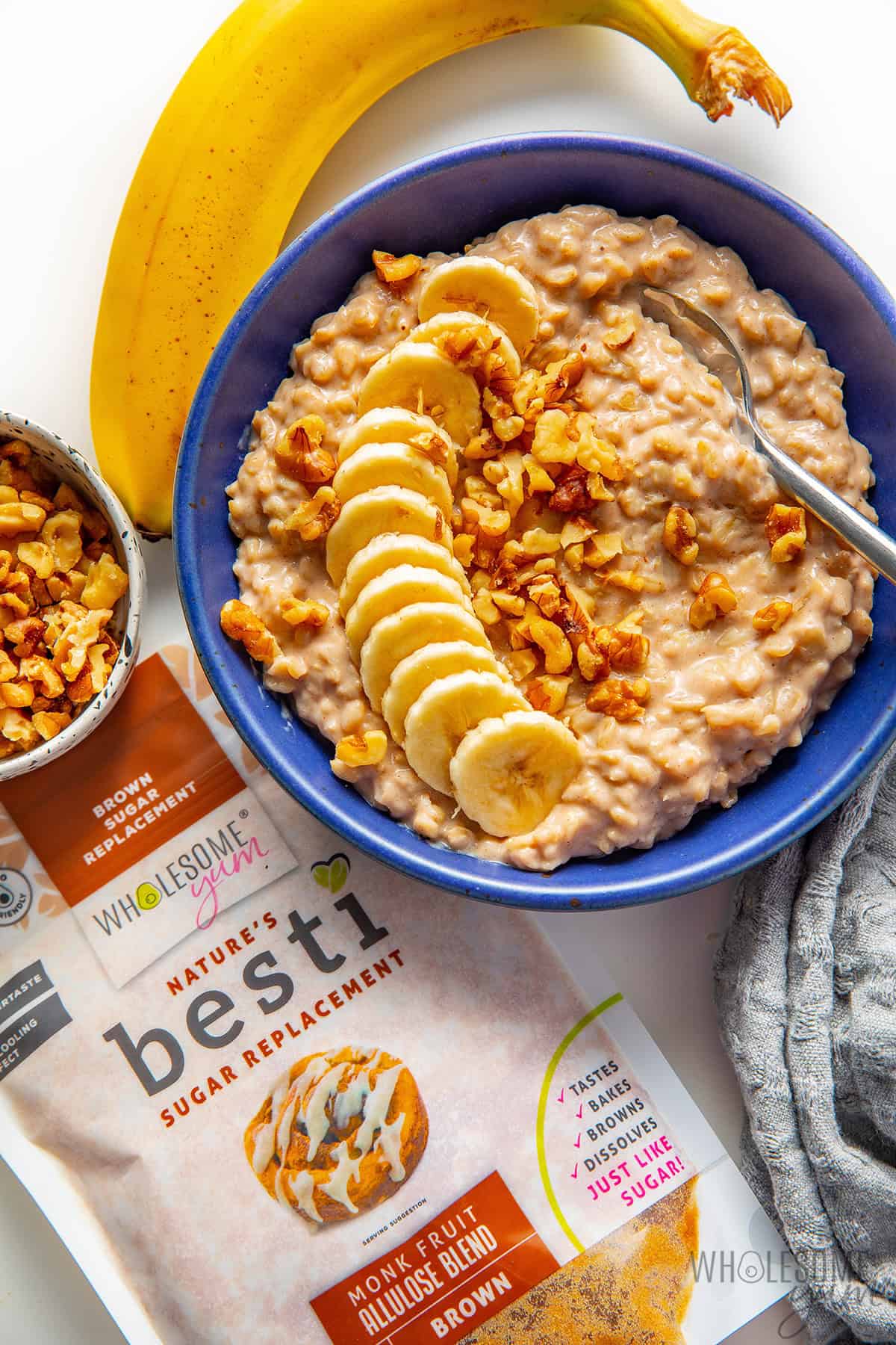 Finished banana oatmeal recipe in a bowl with garnishes.