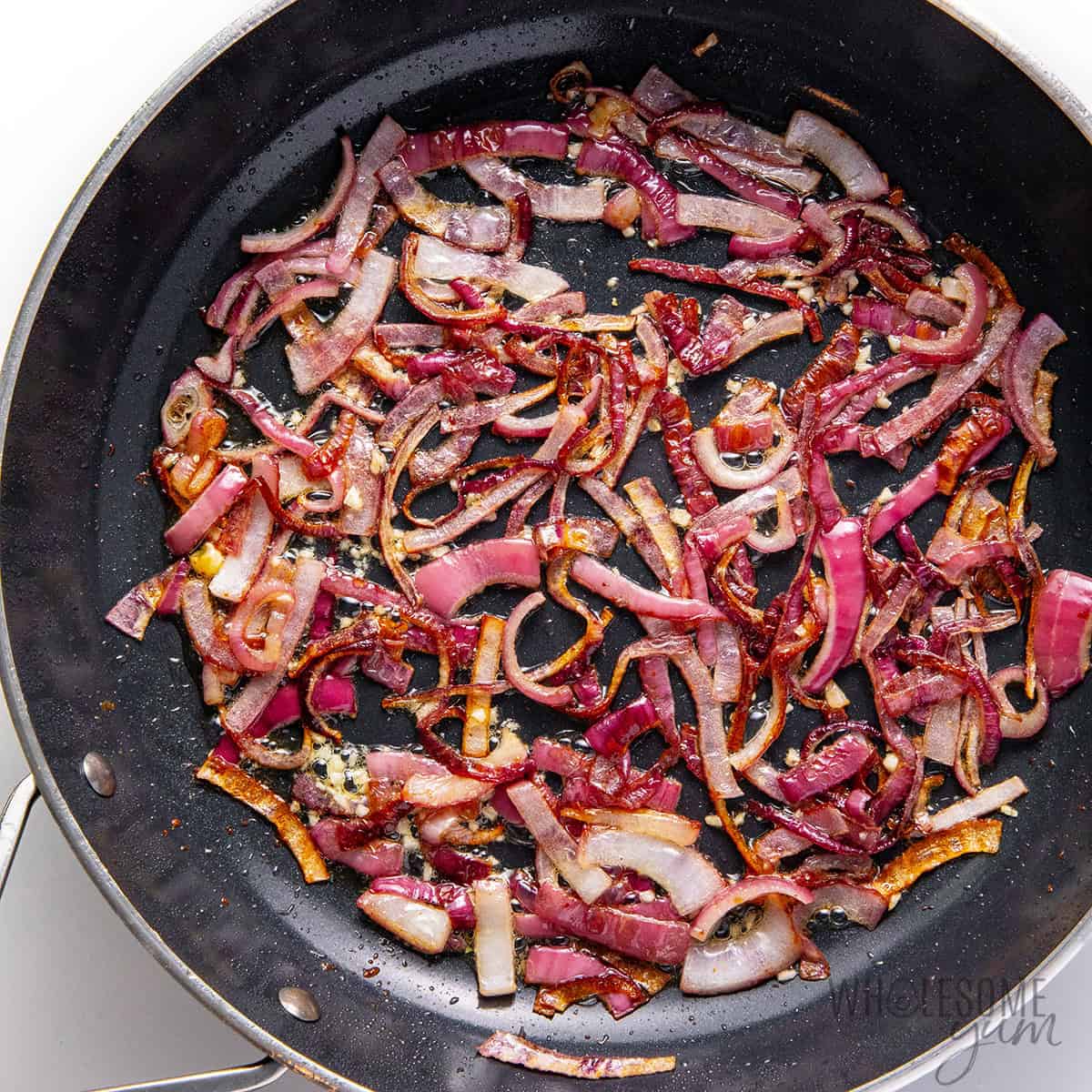 Sauteeing onions and garlic in the skillet.