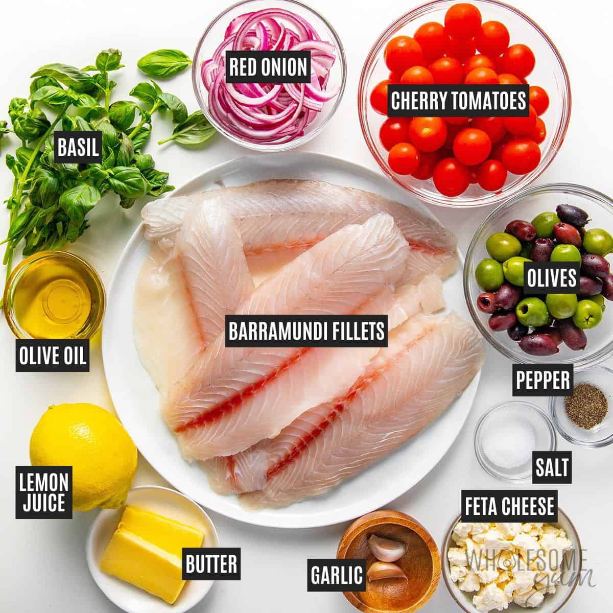 Labeled recipe ingredients: Barramundi fillets, olive oil, unsalted butter, red onion, garlic, cherry tomatoes, olives, lemon juice, fresh basil, feta cheese, salt and pepper.