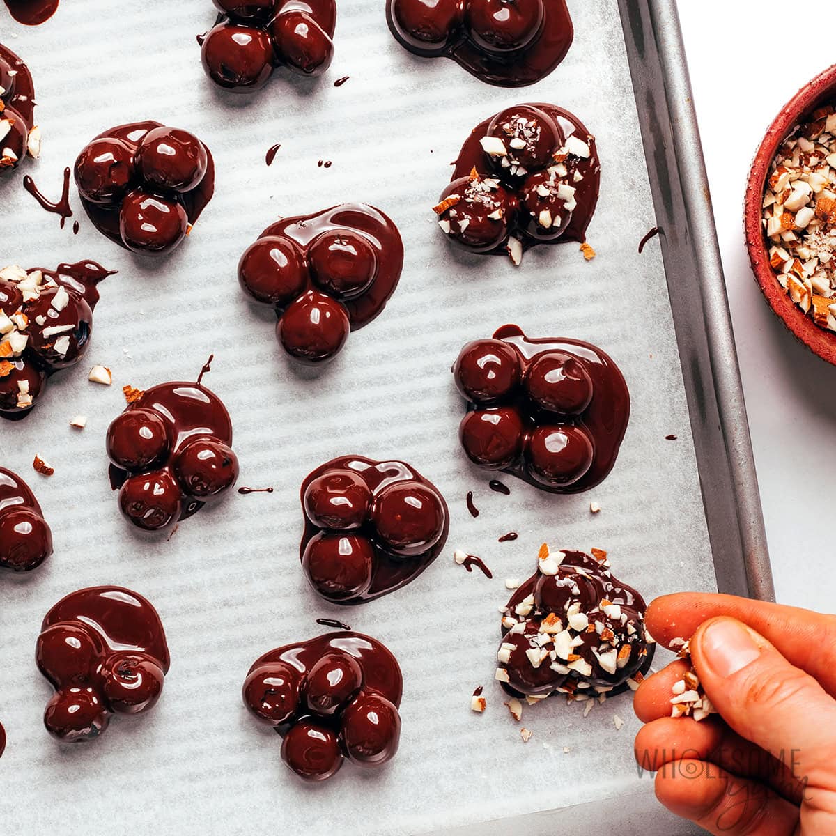 Chocolate blueberry clusters topped with almonds.
