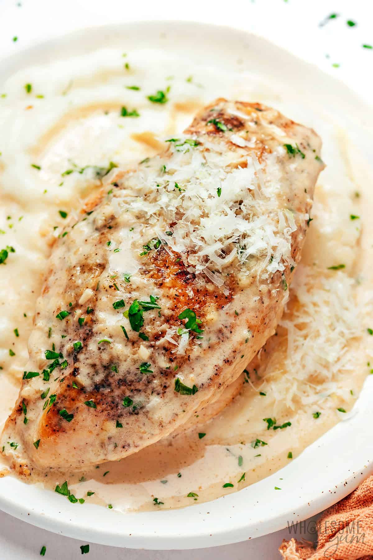 Garlic parmesan chicken breast over mash.