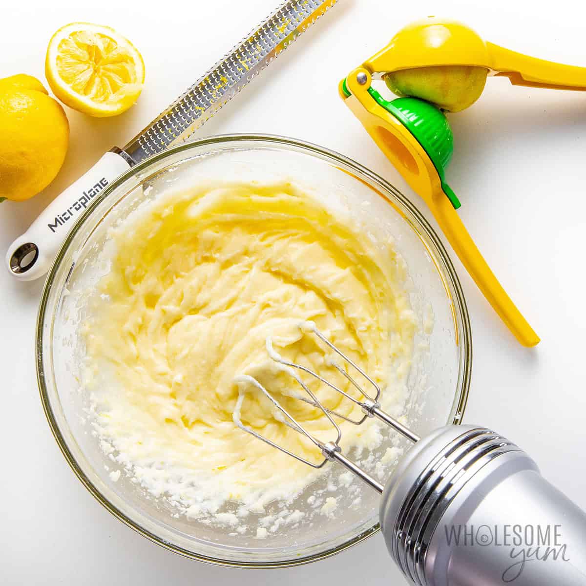 Mascarpone, powdered sweetener, and lemon beat together in a bowl.