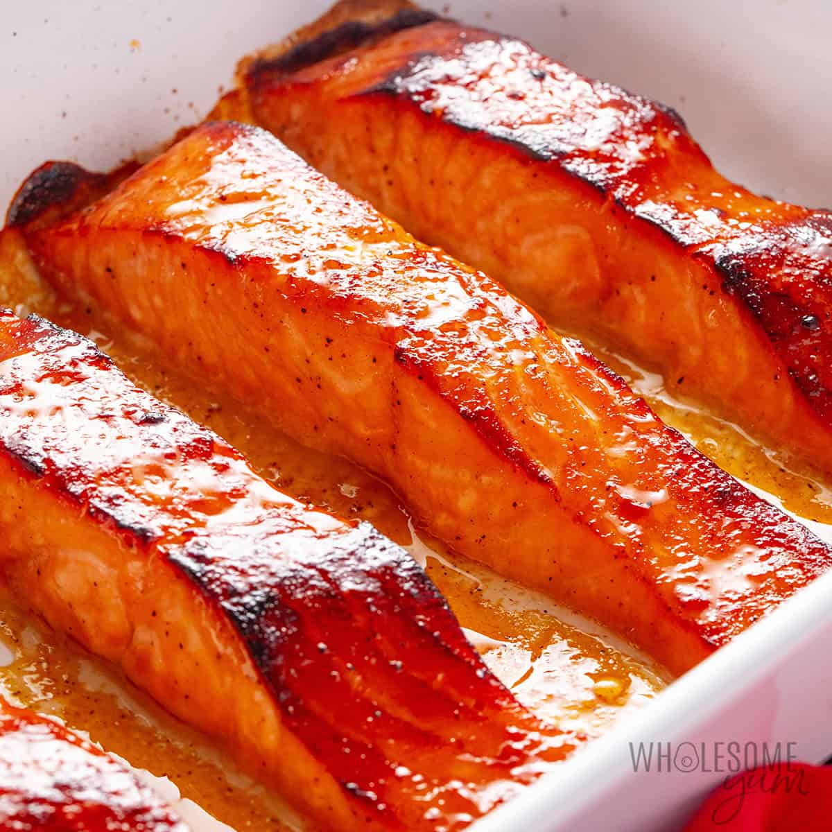 Maple glazed salmon in a baking dish.