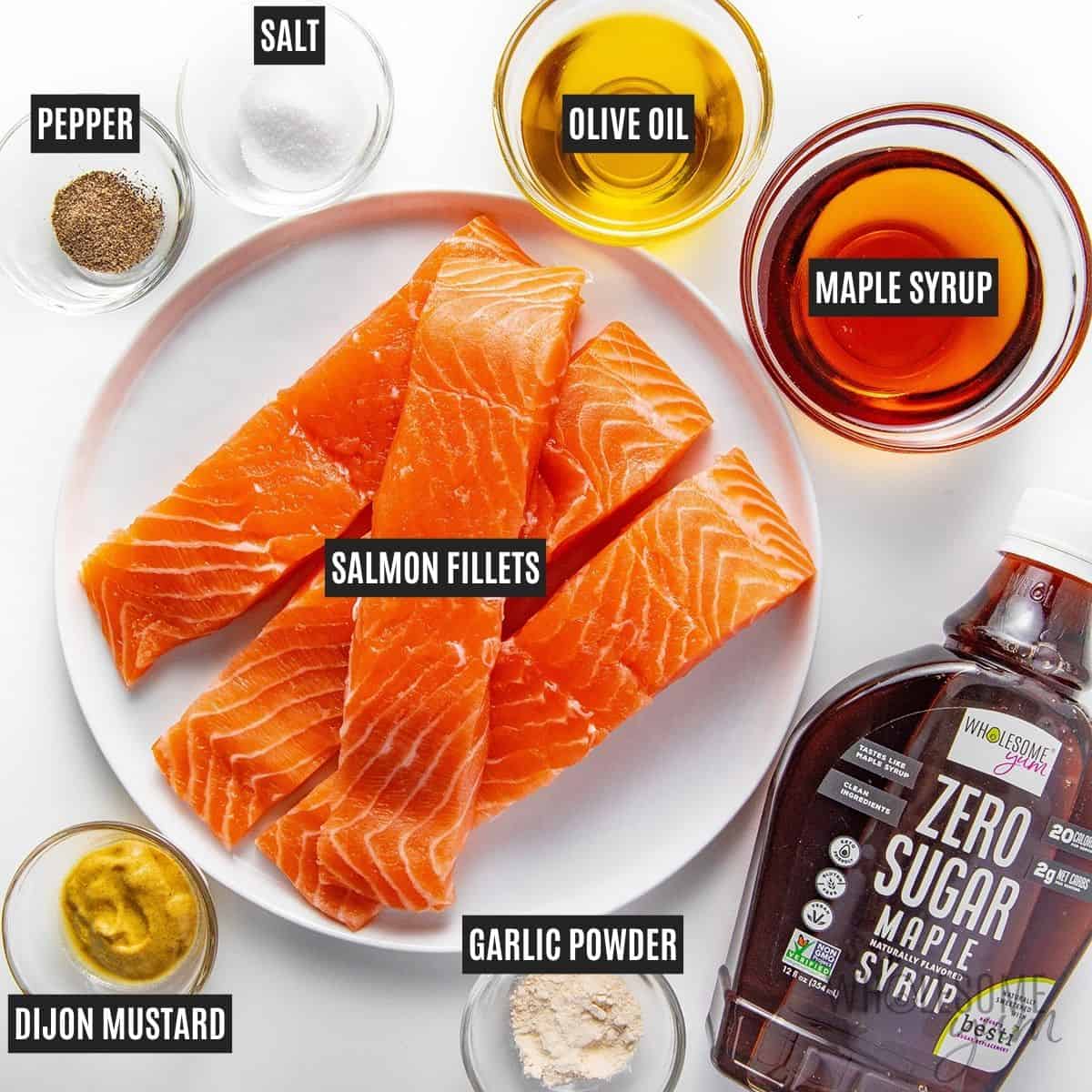Labeled recipe ingredients: Salmon fillets, Wholesome Yum Zero Sugar Maple Syrup, olive oil, Dijon mustard, garlic powder, salt, and pepper.