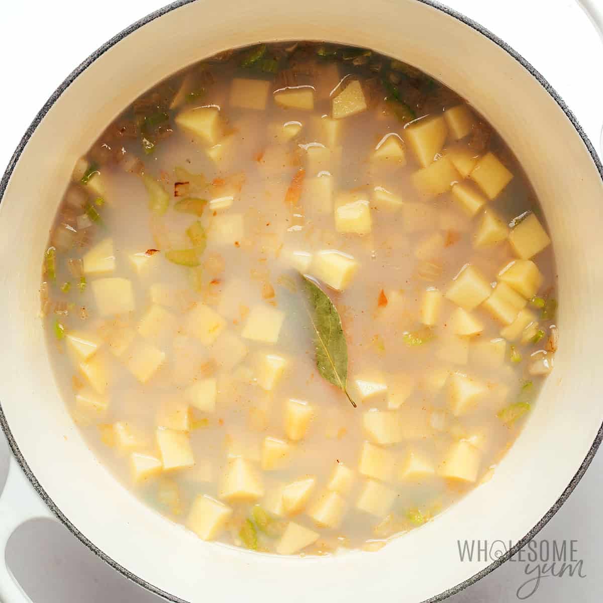 Simmering potatoes in the Dutch oven.