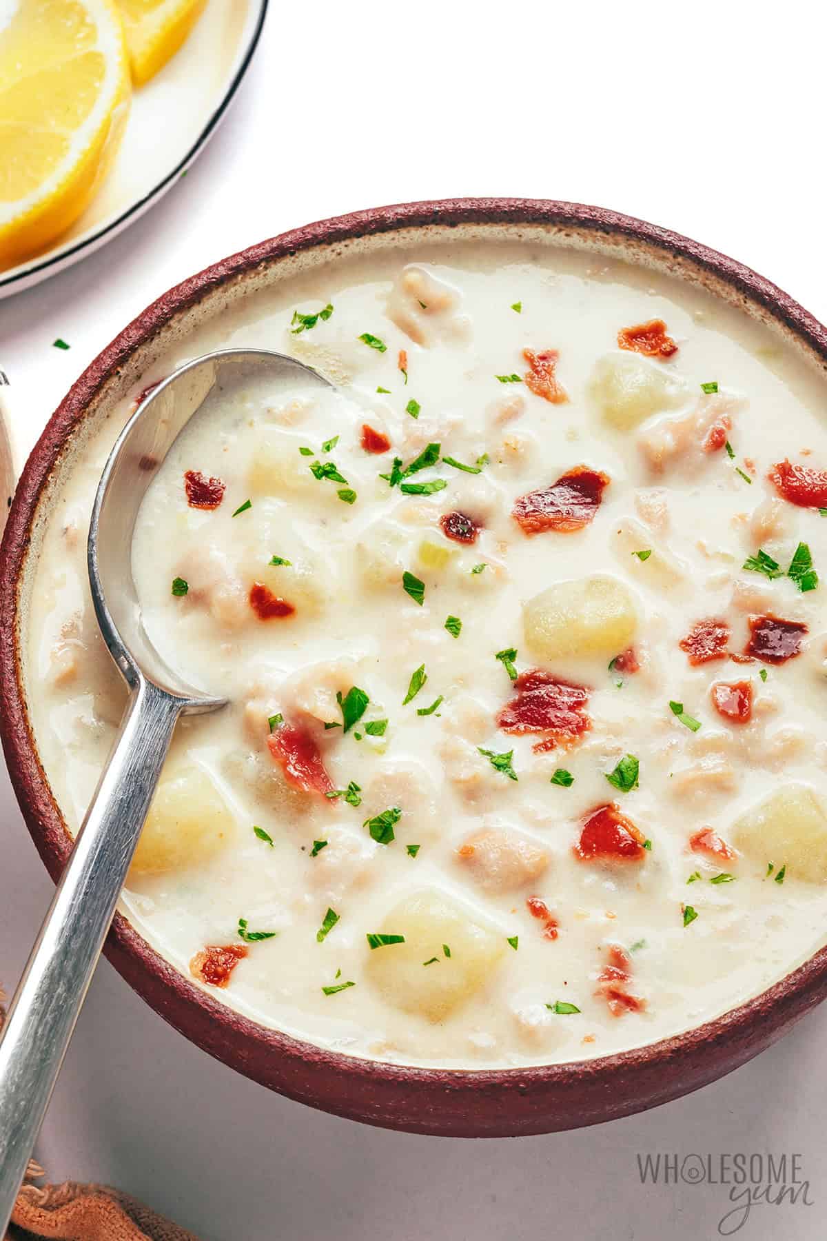 A bowl filled with creamy, cozy clam chowder.