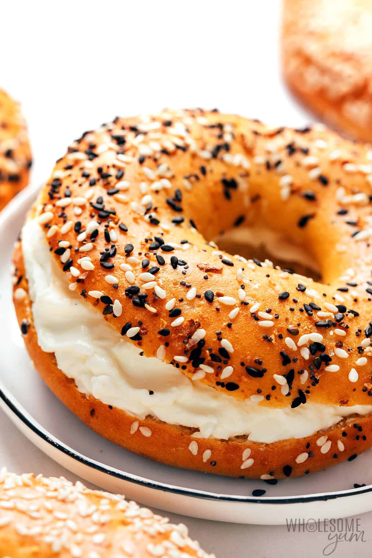 Cottage cheese bagel smeared with cream cheese.
