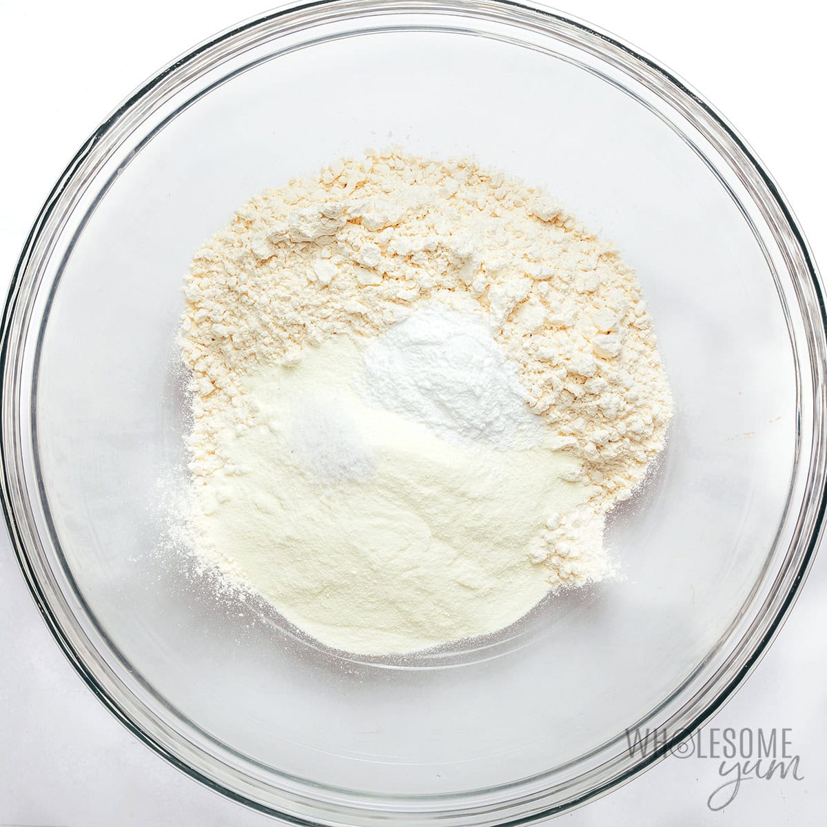 Dry ingredients for cottage cheese bagels in a large bowl