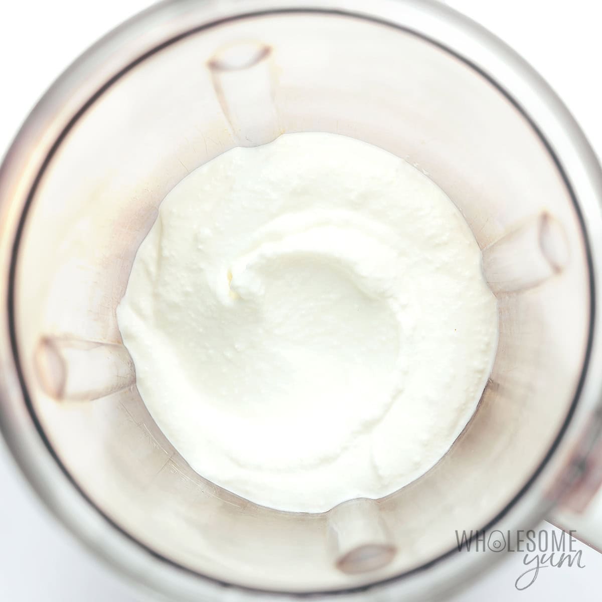 Blending cottage cheese in a blender.