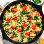 Breakfast scramble with eggs in a skillet.