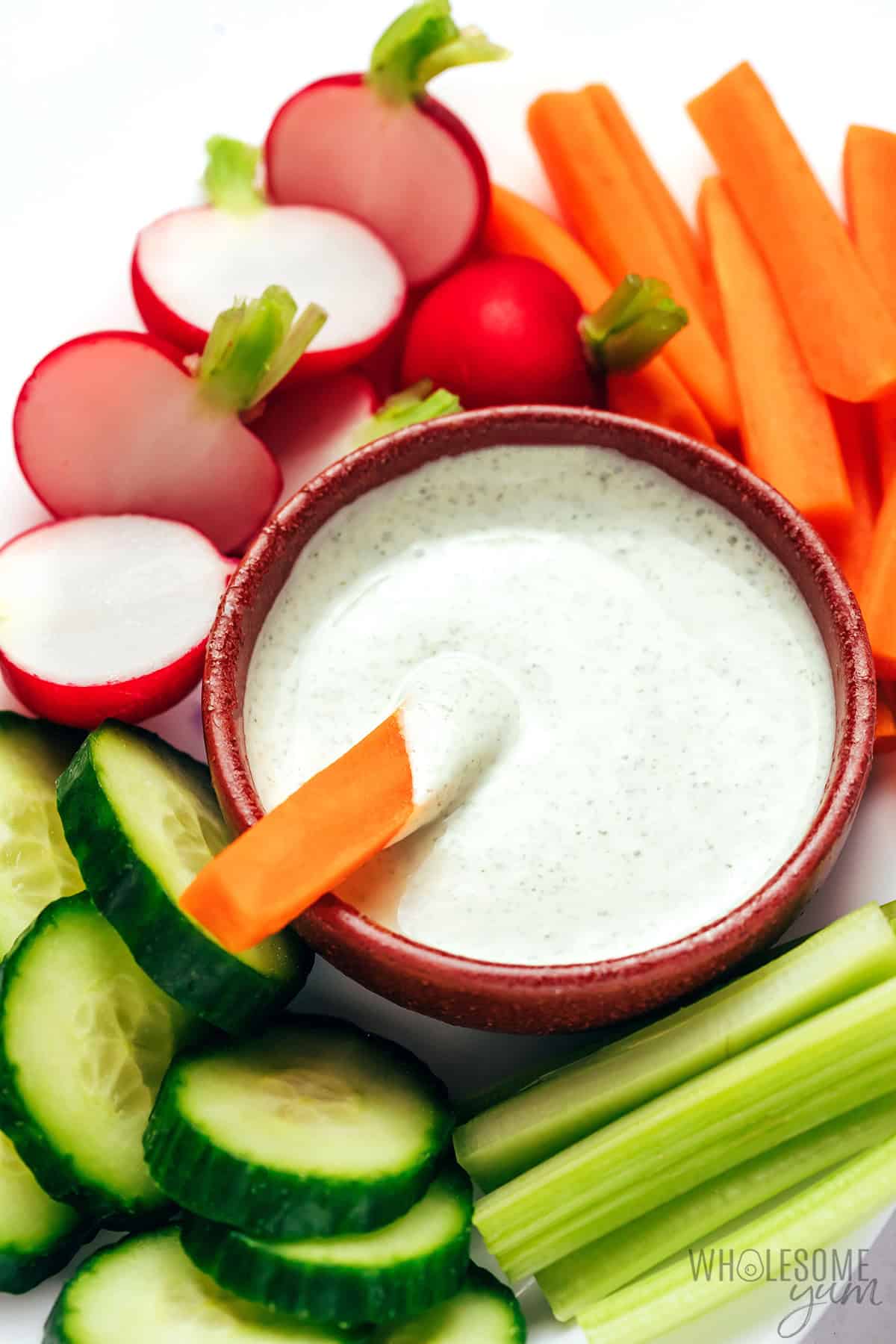 Greek yogurt ranch dip in a bowl with veggies.