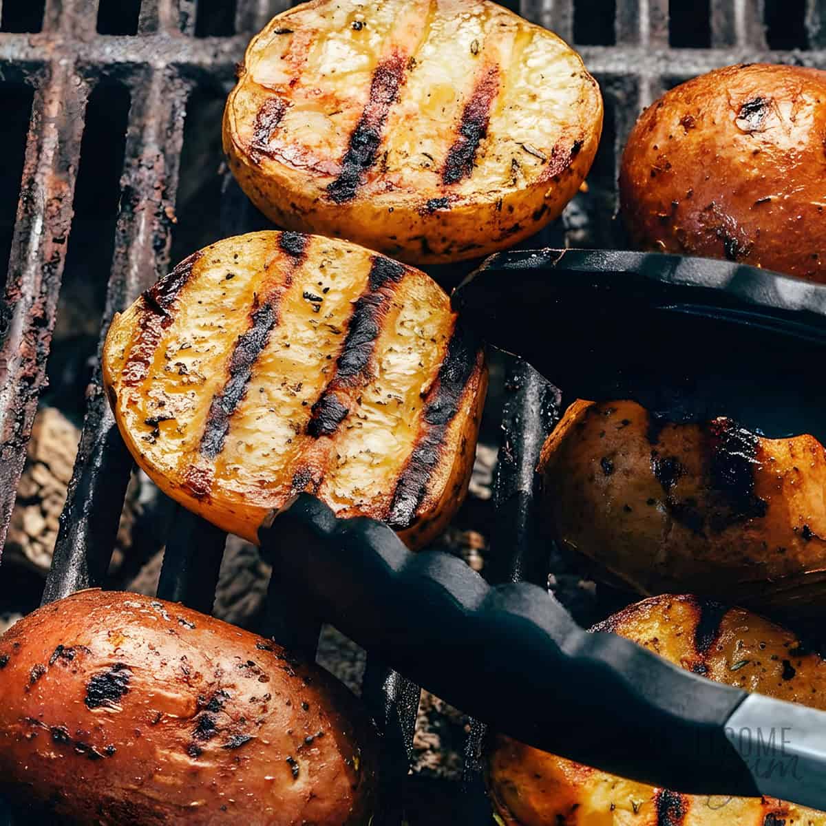 Potatoes on the grill grates.