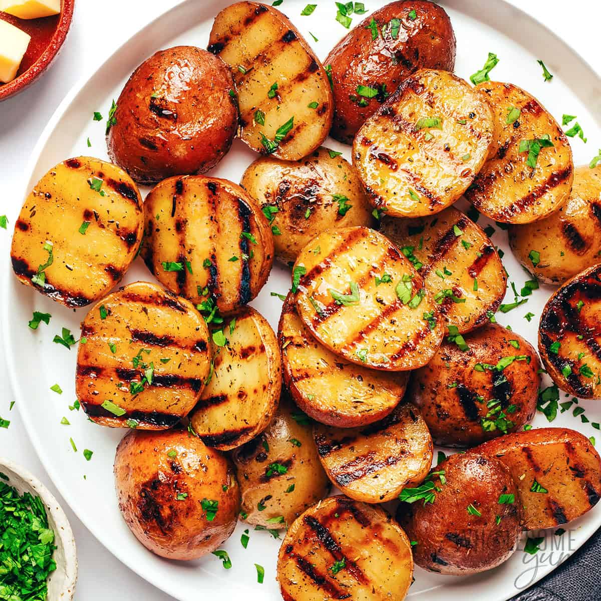 Finished grilled potatoes recipe on a serving plate.