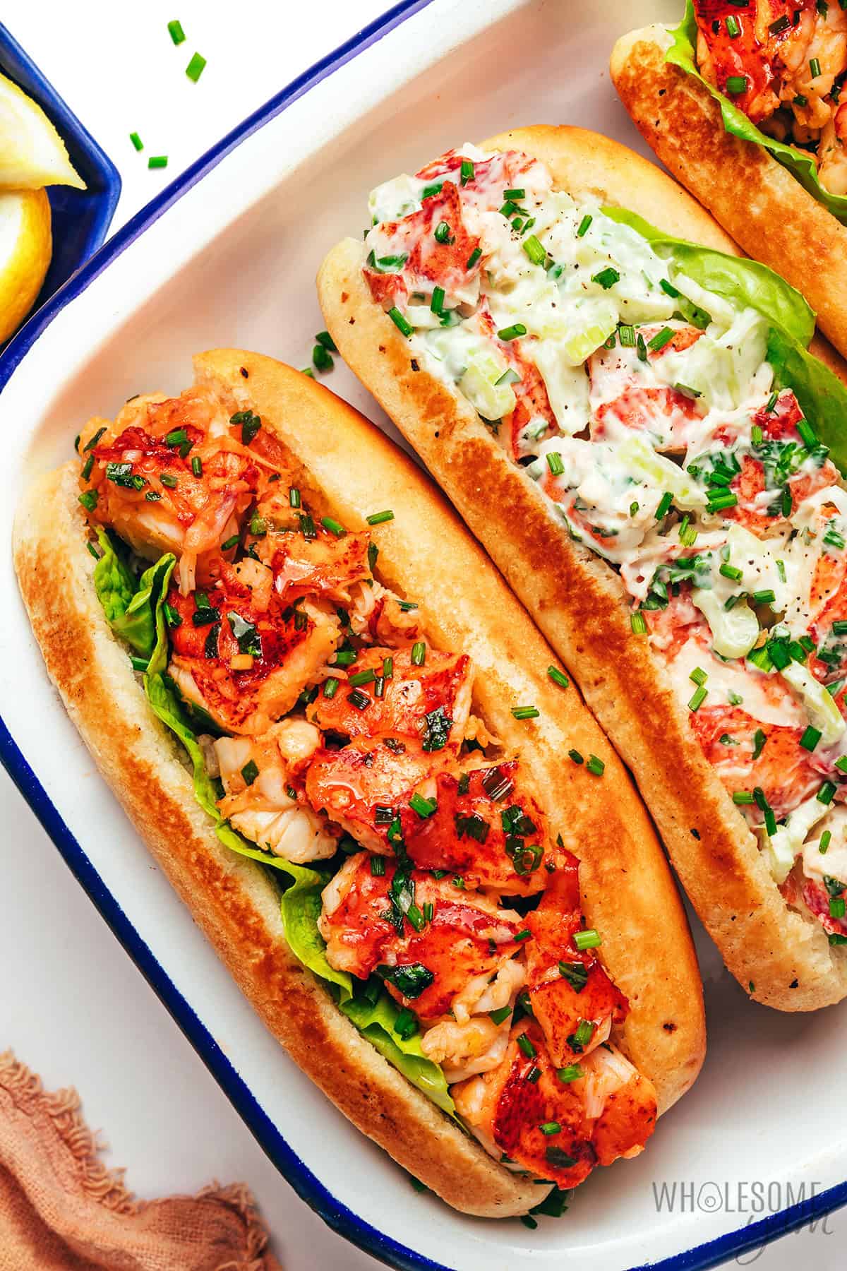 Two types of lobster rolls: hot, buttery Connecticut lobster roll and cold, creamy Maine lobster roll.