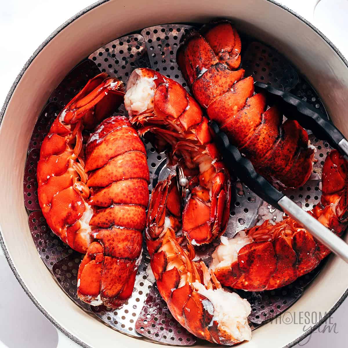 Cooking lobster in a large pot.