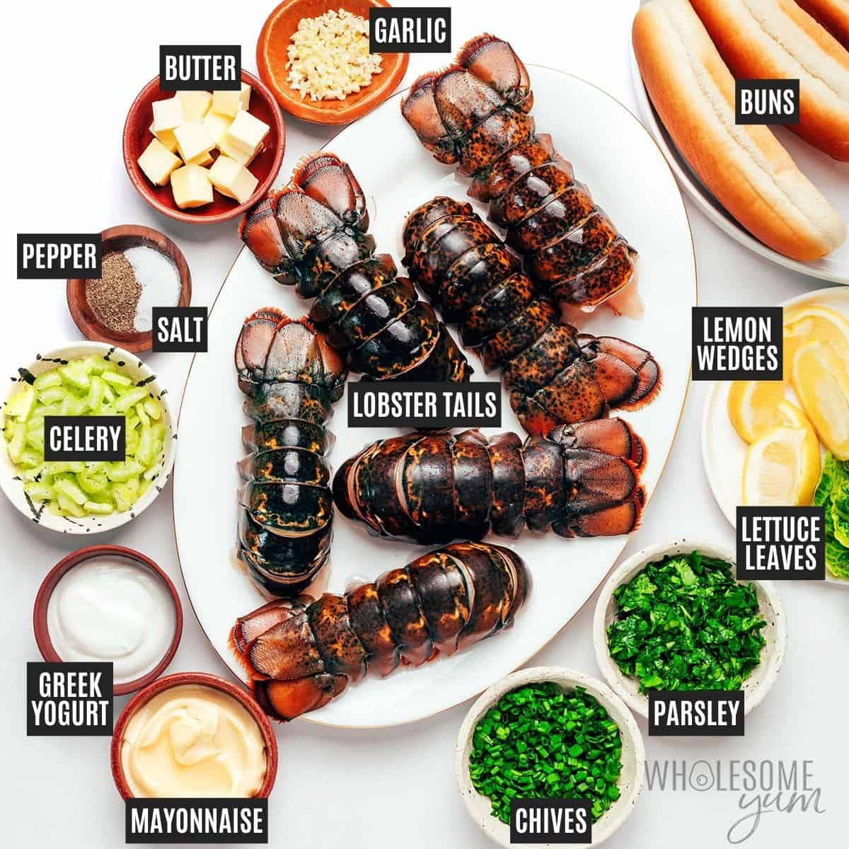 Labeled recipe ingredients: Lobster tails, unsalted butter, garlic, fresh parsley, fresh chives, sea salt, black pepper, avocado mayonnaise, Greek yogurt, celery, hot dog buns, butter, lettuce leaves, and lemon wedges.