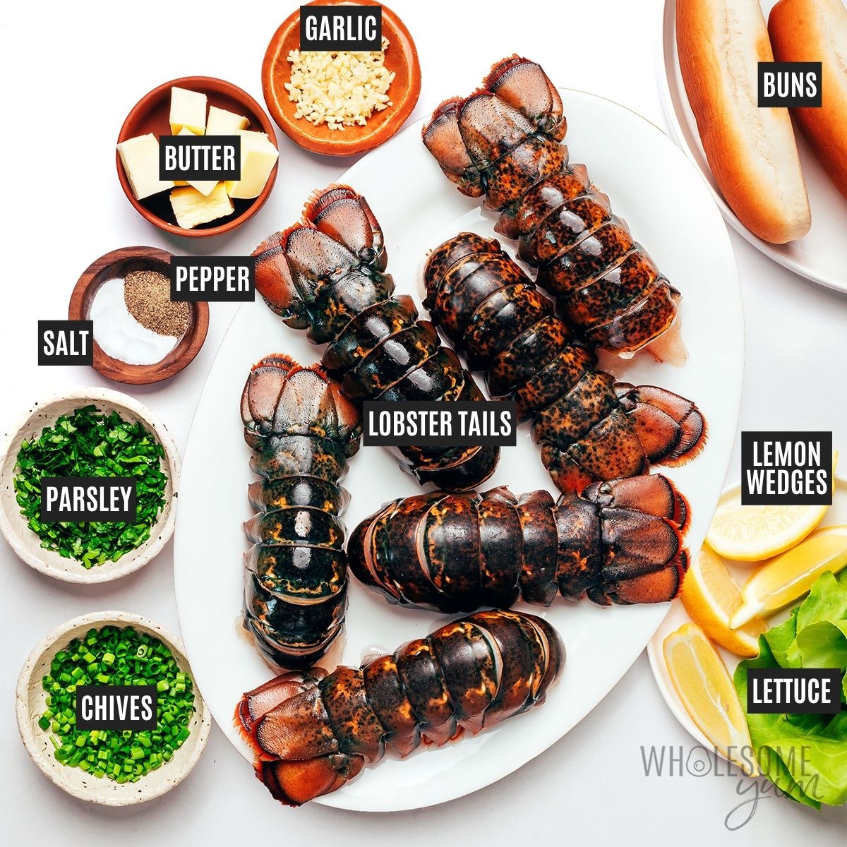 Connecticut lobster roll ingredients: Lobster tails, butter, garlic, herbs, salt, and pepper, plus ingredients for serving.