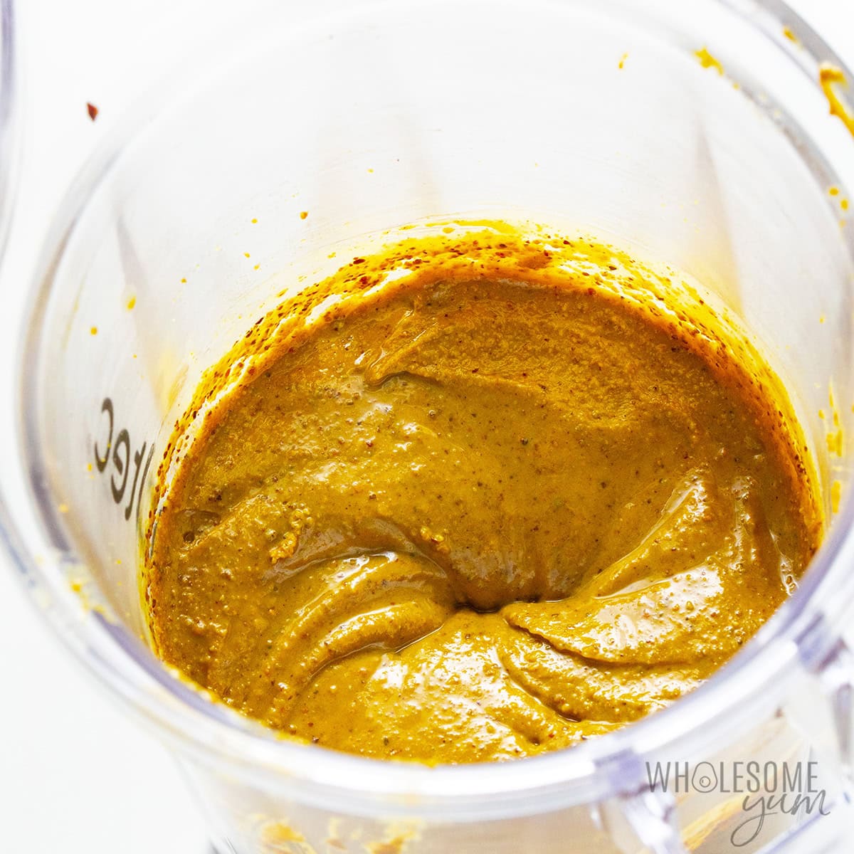 Blending pistachio butter in a blender.