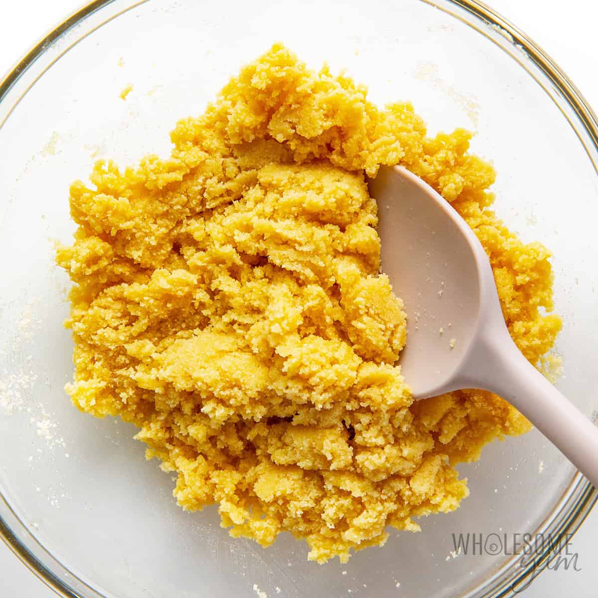 Mixing crust ingredients in a bowl.