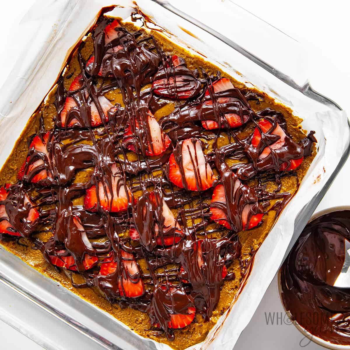 Strawberries added to the bars and more chocolate drizzled on top.