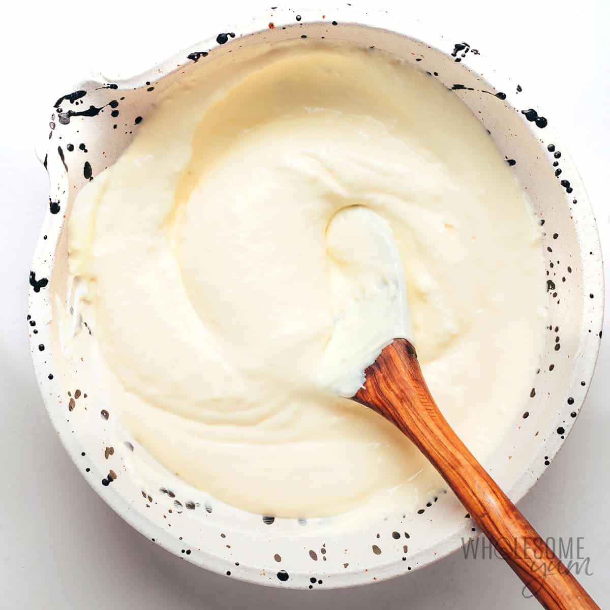 Cream cheese, mayo, and parmesan stirred in a bowl, until creamy.