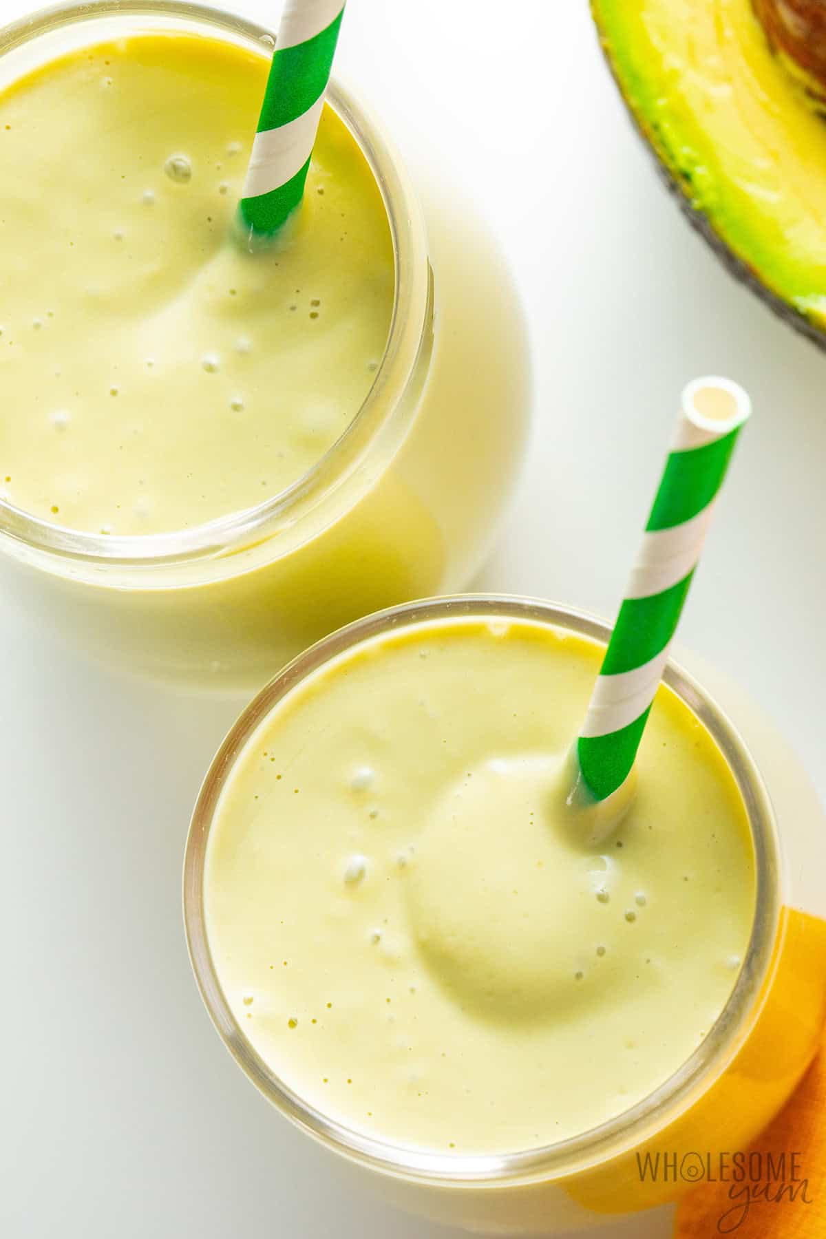 Avocado banana smoothie in a glass from overhead, showing the thick texture.