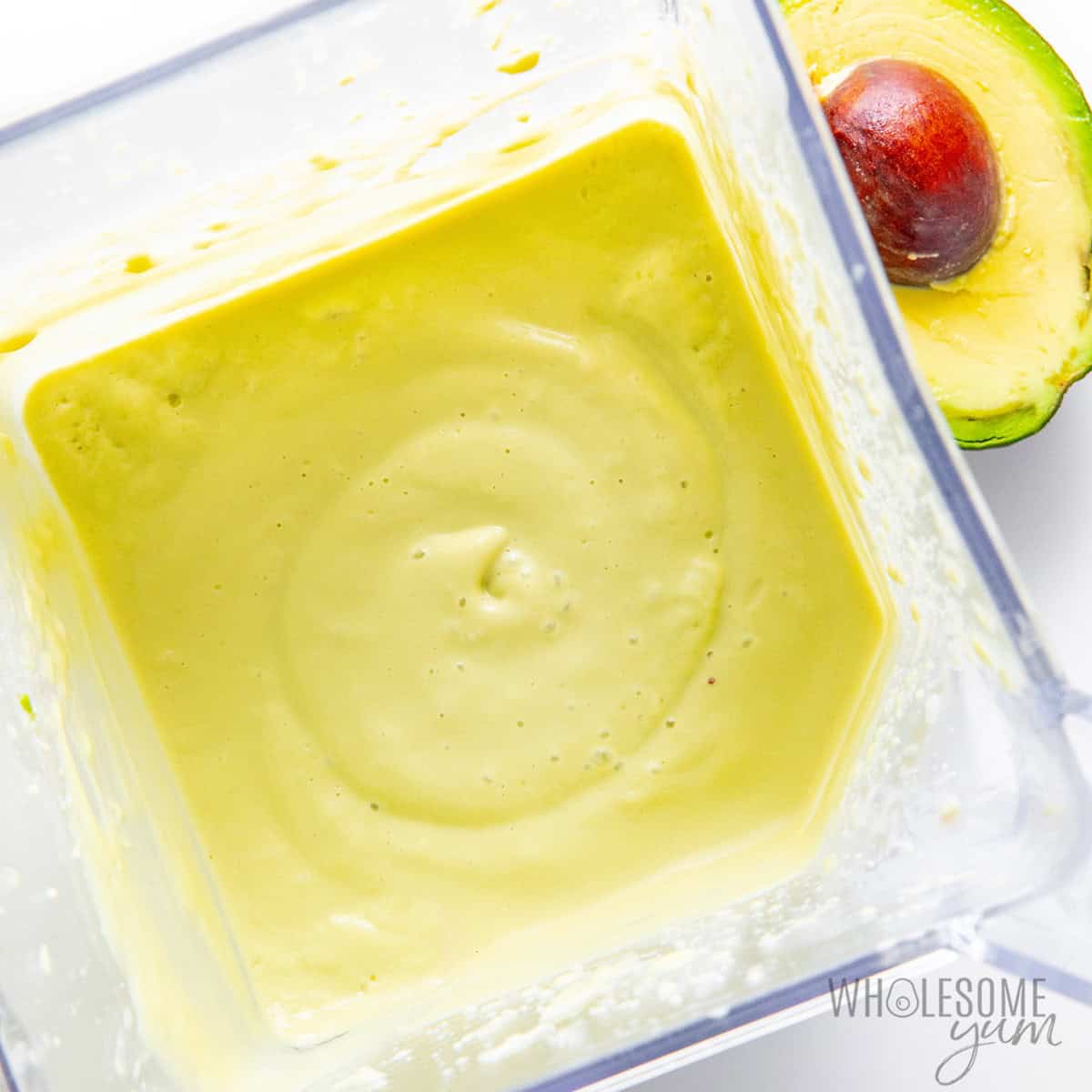 Avocado smoothie recipe blended in a blender.