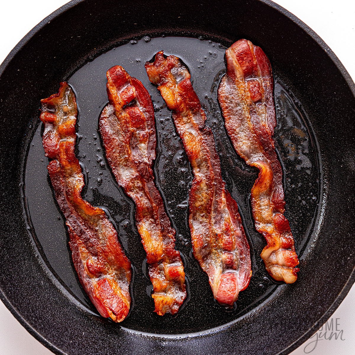 Bacon in a cast iron skillet.