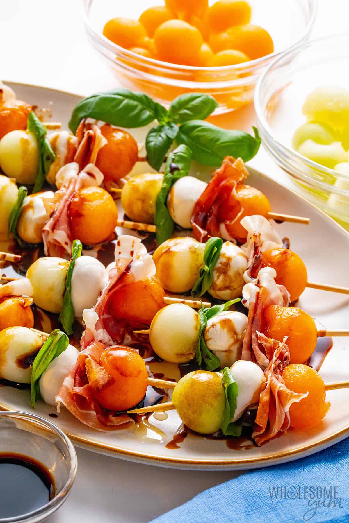 Prosciutto and melon drizzled with balsamic glaze and honey.