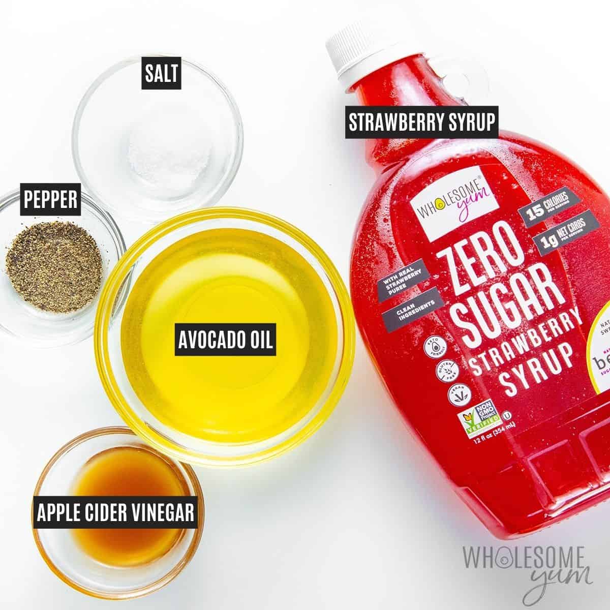 Ingredients for homemade strawberry dressing: strawberry syrup, apple cider vinegar, avocado oil, salt, and pepper.