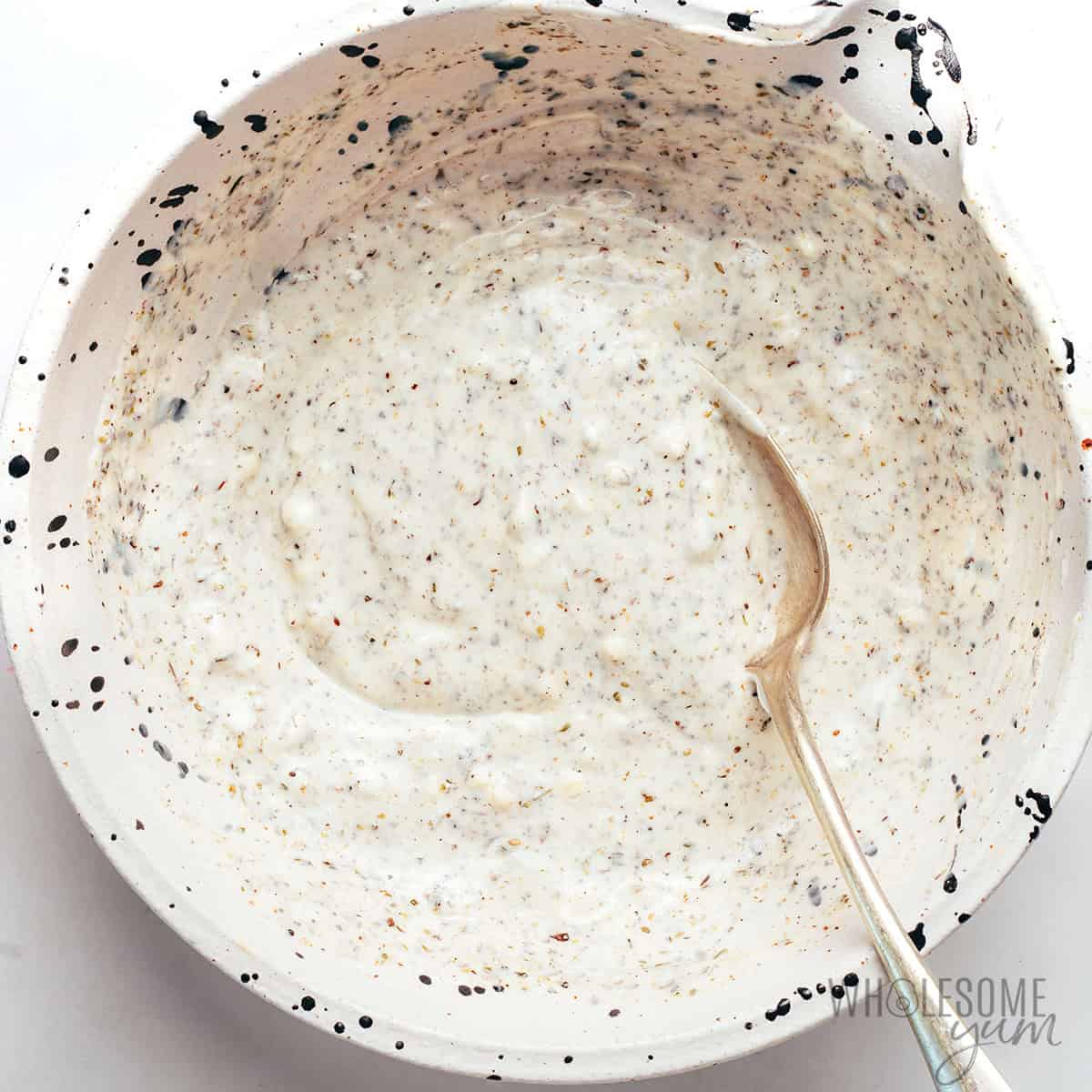 Greek yogurt chicken marinade in a bowl.