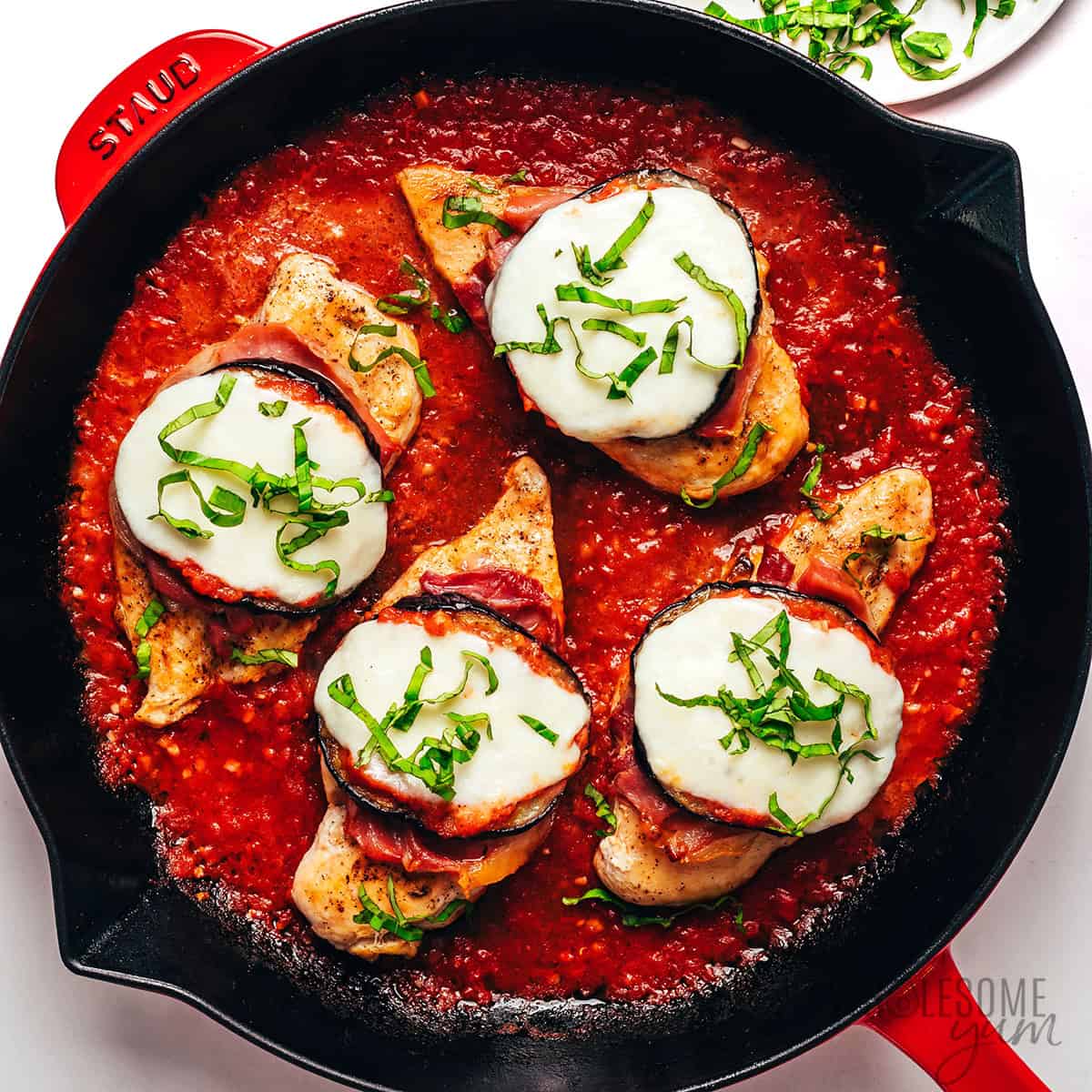 Finished chicken Sorrentino recipe with fresh basil ribbons.