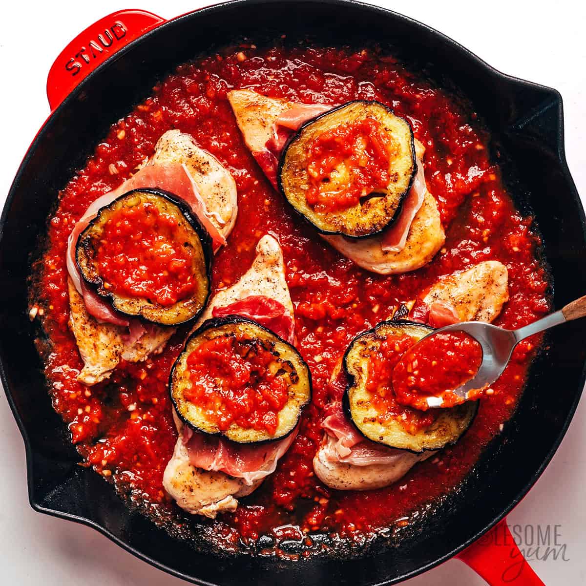 Eggplant and sauce layered over the prosciutto.