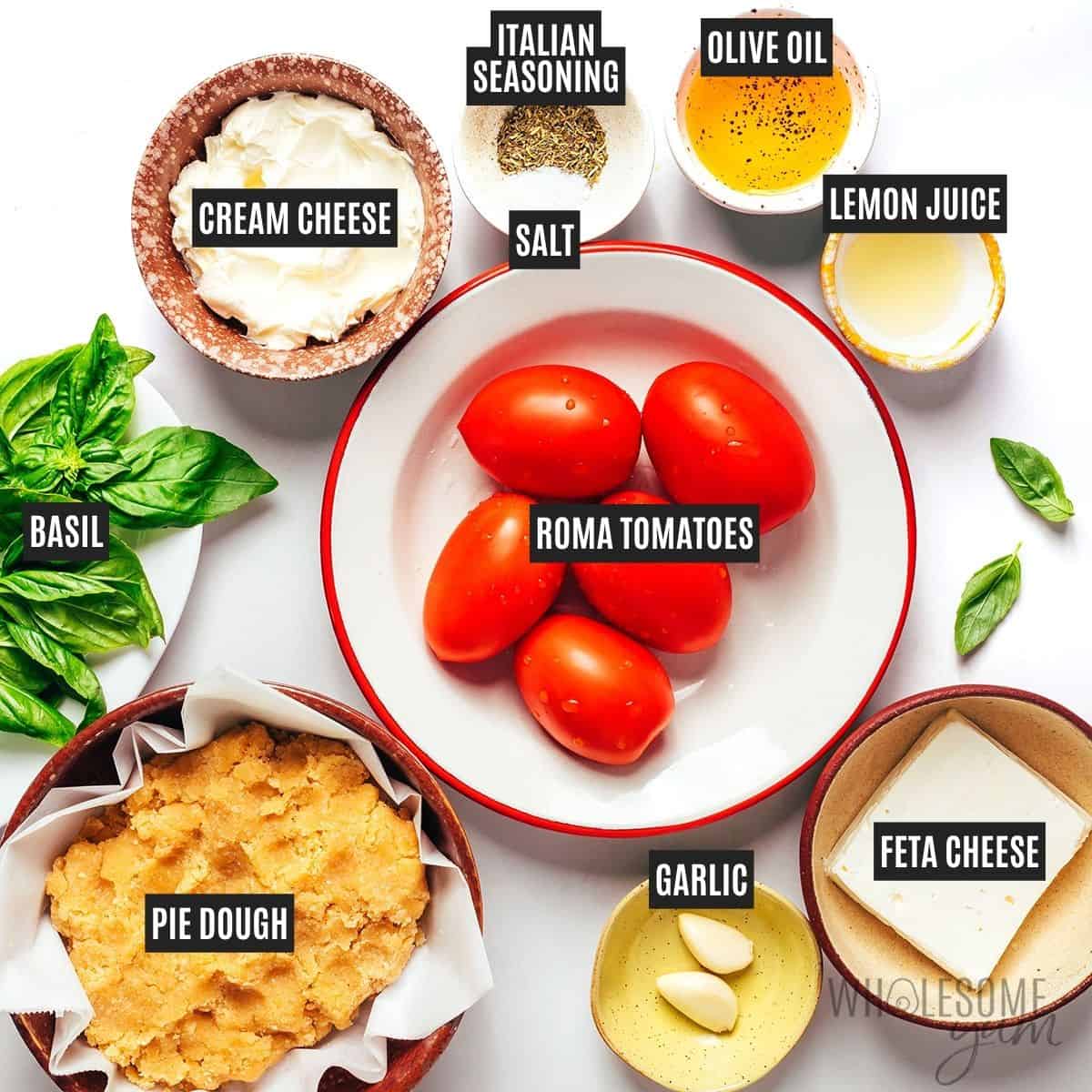 Labeled recipe ingredients: gluten-free pie dough, Roma tomatoes, feta cheese, cream cheese, olive oil, lemon juice, garlic, Italian seasoning, sea salt, and fresh basil.