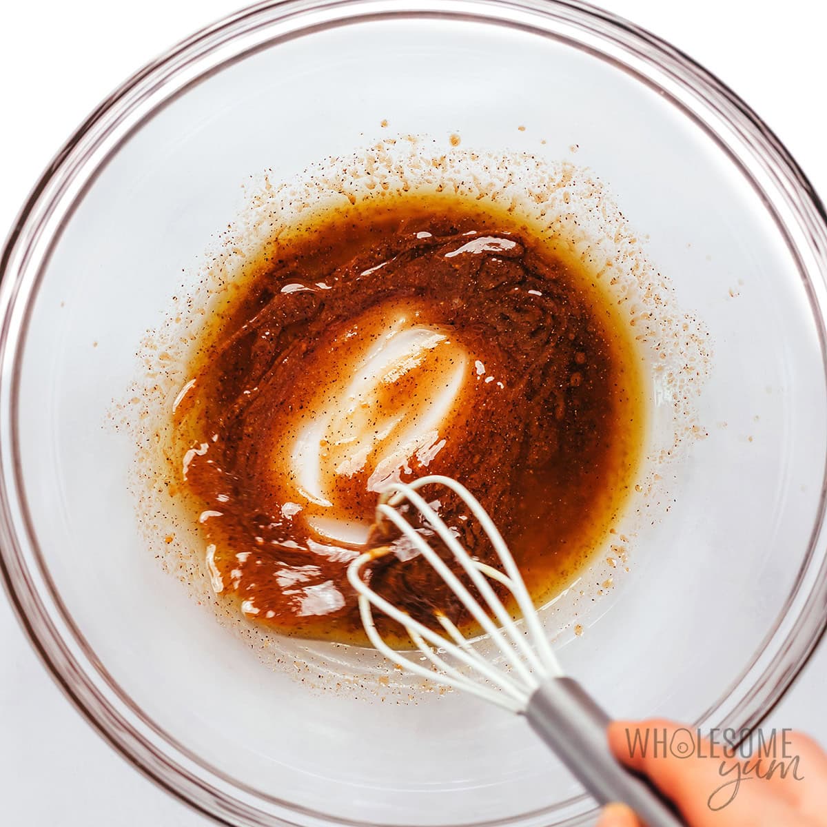 Balsamic-Dijon marinade whisked in a bowl.