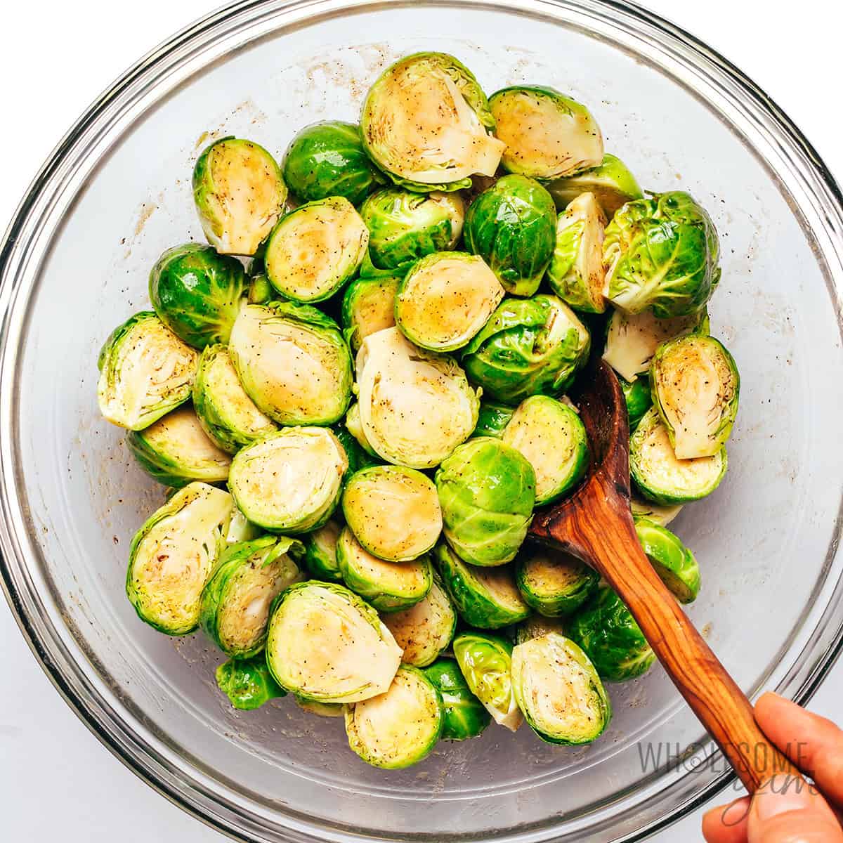 Sprouts marinating in a bowl.